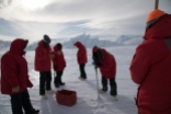 Learning to drill out sea ice cracks. (Credit: Justin)